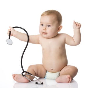 Adorable Baby Boy  with stethoscope on white background